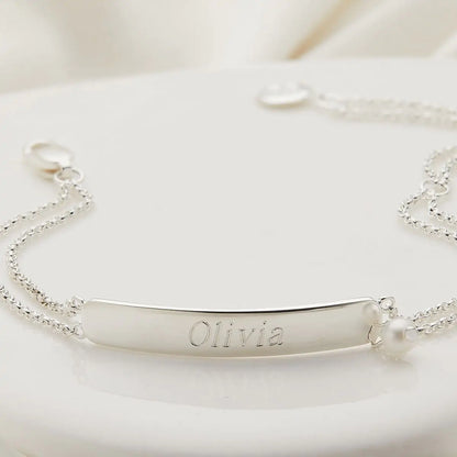 Silver bracelet with 'Olivia' engraving on a white background
